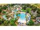 Aerial view of community pool and landscaping at 7652 Whisper Way # 302, Reunion, FL 34747