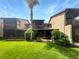 Townhome with a large grassy backyard, screened patio, and partial golf course view at 360 Golfside Cv # 360, Longwood, FL 32779