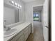 Bathroom with vanity, mirror, and access to bedroom at 360 Golfside Cv # 360, Longwood, FL 32779