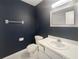 Bathroom with white vanity, toilet and dark blue walls at 360 Golfside Cv # 360, Longwood, FL 32779