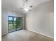 Spacious bedroom with sliding glass doors to balcony at 360 Golfside Cv # 360, Longwood, FL 32779