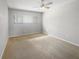 Simple bedroom with carpeted floor and a ceiling fan at 360 Golfside Cv # 360, Longwood, FL 32779