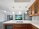 Modern kitchen with island, stainless steel appliances, and white quartz countertops at 360 Golfside Cv # 360, Longwood, FL 32779