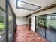 Spacious screened patio with tile flooring and access to the backyard at 360 Golfside Cv # 360, Longwood, FL 32779