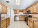 Updated kitchen with granite counters and wood cabinets at 601 Marlin Rd, Winter Springs, FL 32708