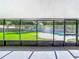 Screened patio overlooking the backyard pool and lawn at 601 Marlin Rd, Winter Springs, FL 32708