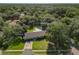 Aerial view of single-Gathering home with pool and large lot in a wooded neighborhood at 601 Marlin Rd, Winter Springs, FL 32708