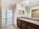 Bathroom boasts granite vanity, large mirror, and tiled flooring at 601 Marlin Rd, Winter Springs, FL 32708