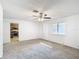 Spacious bedroom with kitchen access and window at 601 Marlin Rd, Winter Springs, FL 32708
