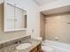 Bathroom with granite vanity, tub, and shower at 601 Marlin Rd, Winter Springs, FL 32708