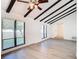Living room with vaulted ceiling, exposed beams, and a ceiling fan at 601 Marlin Rd, Winter Springs, FL 32708