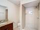 Bathroom with shower, granite vanity, and toilet at 601 Marlin Rd, Winter Springs, FL 32708