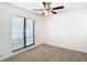 Bedroom with large window and ceiling fan at 601 Marlin Rd, Winter Springs, FL 32708