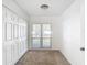 Well-lit bedroom featuring a double door closet and window at 601 Marlin Rd, Winter Springs, FL 32708