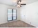 Bright bedroom with carpet, large window, and ceiling fan at 601 Marlin Rd, Winter Springs, FL 32708