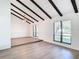 Spacious living room with vaulted ceiling, wood beams and lots of natural light at 601 Marlin Rd, Winter Springs, FL 32708