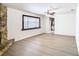 Bright living room with hardwood floors and kitchen view at 601 Marlin Rd, Winter Springs, FL 32708
