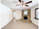 Living room with stone fireplace and hardwood floors at 601 Marlin Rd, Winter Springs, FL 32708