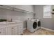 Bright laundry room with ample storage space at 8300 Ludington Cir, Orlando, FL 32836