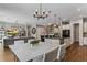Modern kitchen with white cabinets, breakfast bar, and stainless steel appliances at 8300 Ludington Cir, Orlando, FL 32836