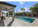 Resort-style backyard with a pool and covered patio at 8300 Ludington Cir, Orlando, FL 32836