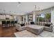 Open concept Gathering room with a large sectional sofa and kitchen views at 8300 Ludington Cir, Orlando, FL 32836