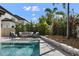 Relaxing poolside patio furniture, perfect for entertaining at 8300 Ludington Cir, Orlando, FL 32836