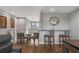 Game room bar with seating and a granite countertop at 8300 Ludington Cir, Orlando, FL 32836