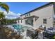 Spacious backyard oasis with a pool and covered patio at 8300 Ludington Cir, Orlando, FL 32836