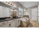 Spa-like bathroom with soaking tub, double vanity, and walk-in shower at 8300 Ludington Cir, Orlando, FL 32836