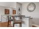 Modern home bar with granite countertop and stylish mirror at 8300 Ludington Cir, Orlando, FL 32836