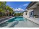 Relax by the pool or play basketball in this large backyard at 8300 Ludington Cir, Orlando, FL 32836