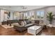 Fun game room with pool table, sectional sofa, and hardwood floors at 8300 Ludington Cir, Orlando, FL 32836