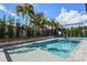 Inviting pool area with a basketball court and lush landscaping at 8300 Ludington Cir, Orlando, FL 32836