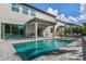 Stunning pool and patio area with modern furniture at 8300 Ludington Cir, Orlando, FL 32836