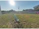 Backyard with a seesaw and partial view of a fence at 181 Silver Maple Bnd, Davenport, FL 33837