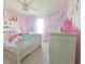Pastel bedroom with a full-size bed and a ceiling fan at 181 Silver Maple Bnd, Davenport, FL 33837