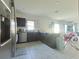 Modern kitchen with stainless steel appliances and granite countertops at 181 Silver Maple Bnd, Davenport, FL 33837