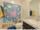 Bathroom with shower/tub, ocean-themed decor at 181 Silver Maple Bnd, Davenport, FL 33837