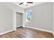 Bedroom with closet and wood-look flooring at 506 Ellie Ct, Apopka, FL 32703