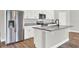 Modern kitchen with stainless steel appliances and granite countertops at 506 Ellie Ct, Apopka, FL 32703
