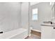 Bathroom with marble tile and granite vanity at 506 Ellie Ct, Apopka, FL 32703