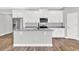 Modern kitchen with white cabinets and granite countertops at 506 Ellie Ct, Apopka, FL 32703