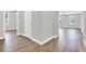 Light and bright hallway with wood-look floors at 506 Ellie Ct, Apopka, FL 32703