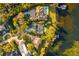 Bird's-eye view of a lakefront home and neighborhood at 7 1St Ct, Windermere, FL 34786