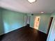 Bedroom with dark wood-look floors and en-suite bathroom at 248 Crown Oaks Way, Longwood, FL 32779