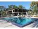 Relaxing community pool with plenty of room for swimming and lounging at 612 Woodland Ct, Lake Mary, FL 32746