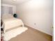 Simple bedroom with a full-size bed and neutral decor at 435 Caribbean Dr, Davenport, FL 33897