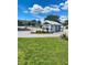Community entrance with guardhouse and well-maintained landscaping at 435 Caribbean Dr, Davenport, FL 33897