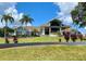 Stunning curb appeal with a grand entrance and lush landscaping at 435 Caribbean Dr, Davenport, FL 33897